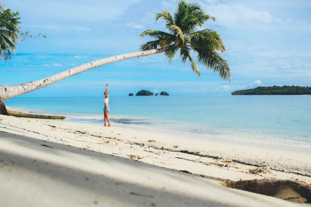 istock Women under the palm tree 876611300
