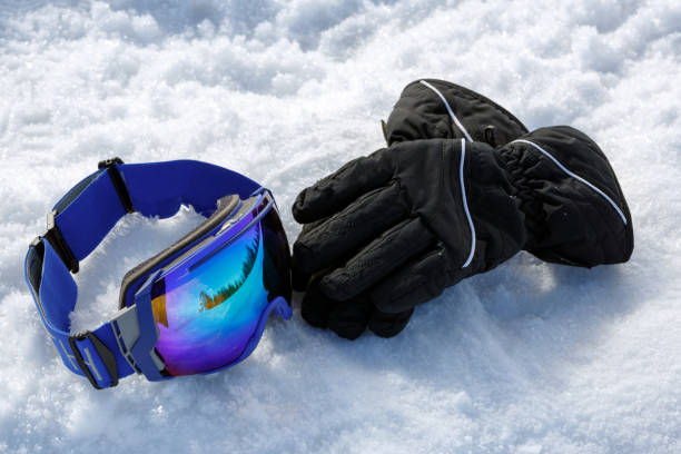 istock Colorful ski mask and gloves on white snow 876621596