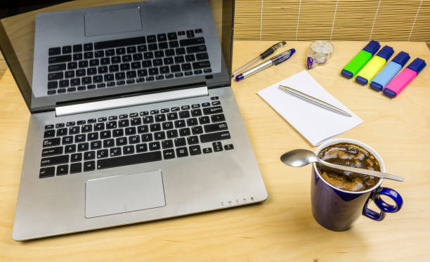 istock Coffee in a mug on a wooden desk. 876622098