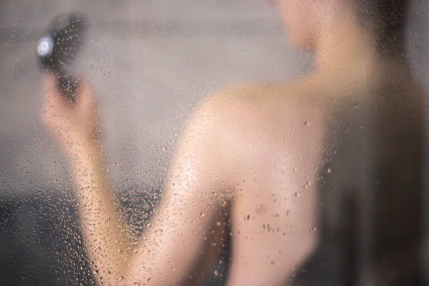 istock Redhead girl taking a shower 876622554