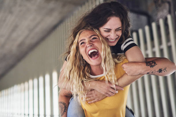 istock Best friends laughing and having a fun night out together 876625808