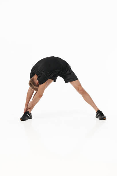 istock Man in sportswear stretching 876626658