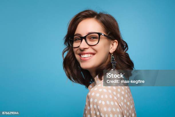 Smiling Woman Posing In Glasses Stock Photo - Download Image Now - Eyeglasses, Women, Portrait