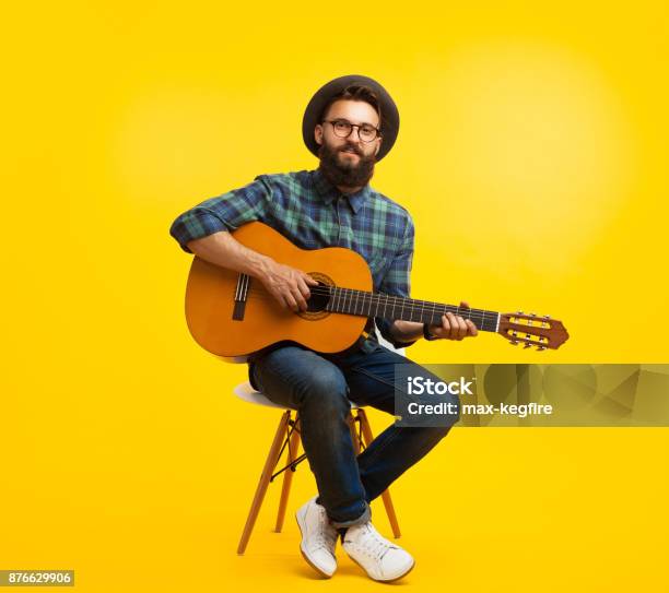 Young Man With Guitar In Studio Stock Photo - Download Image Now - Guitar, Men, Musician