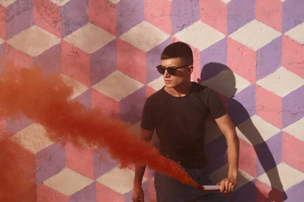 istock Teen with colored smoke 876632522