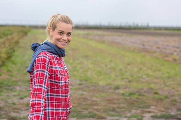 istock woman farmer in small farm 876632836