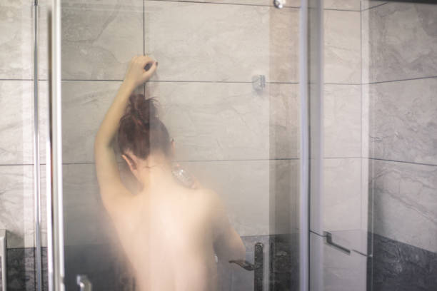istock Redhead girl taking a shower 876633588
