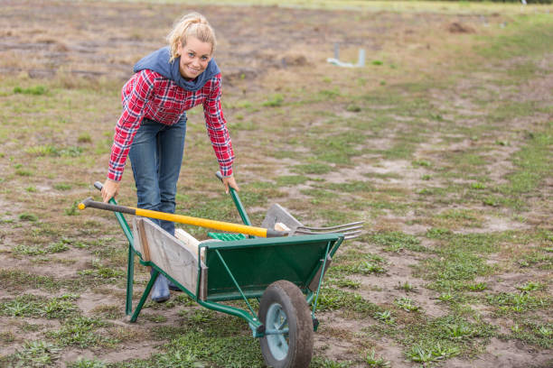 istock woman farmer in small farm 876633598