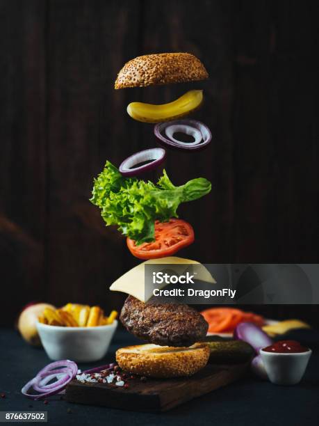 Flying Burger Ingredients Stock Photo - Download Image Now - Burger, Exploding, Falling