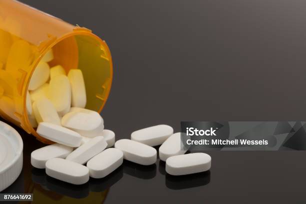 Pills Spilled Out On Table Stock Photo - Download Image Now - Capsule - Medicine, Pill, Prescription