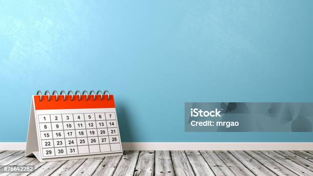 Desk Calendar On Wooden Floor Against Wall Stock Photo - Download Image Now - Calendar, Italy, Wall - Building Feature