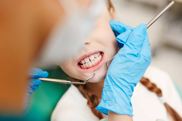 Teeth of patient Little girl showing her teeth to dentist during oral examination clenching teeth stock pictures, royalty-free photos & images