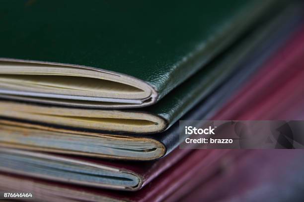 Passports Stacked Up On A Desk At Customspassport Cover Stock Photo - Download Image Now