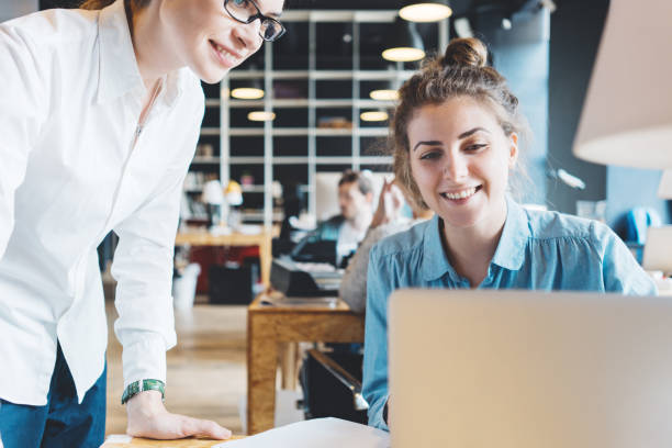 istock Two women talking about new social and digital plans 876655568
