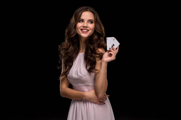 attractive young woman holding the winning combination of poker cards - smiling casino human hand beautiful imagens e fotografias de stock