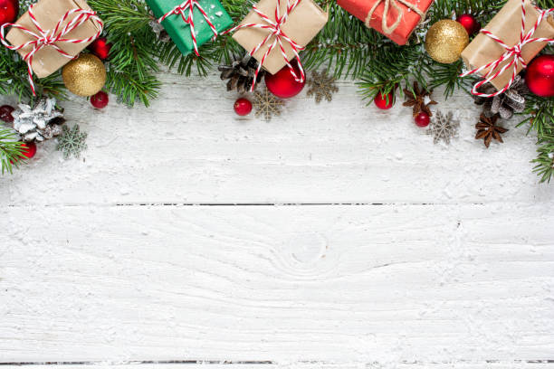 istock Christmas background with fir branches, knitted heart, decorations, gift boxes and pine cones 876655922