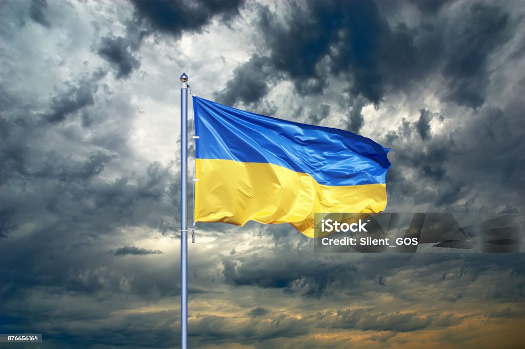 Ukraine flag. Ukrainian flag on black storm cloud sky. stormy weather Ukraine Stock Photo