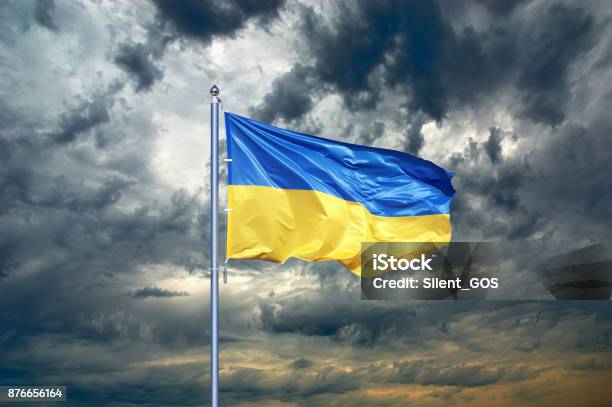 Ukraine Flag Ukrainian Flag On Black Storm Cloud Sky Stormy Weather Stock Photo - Download Image Now