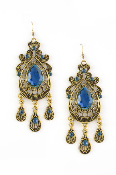 istock gold earrings with blue stones isolated on white 876656274