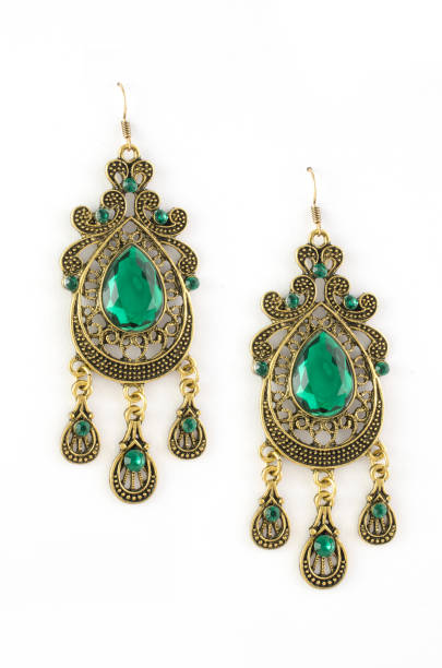 istock gold earrings with green stones isolated on white 876656306