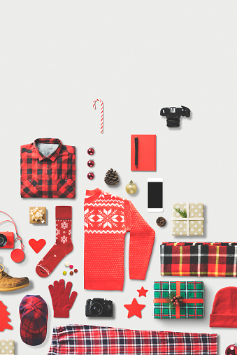 Christmas theme red apparel, ornament, gift box flat lay on white background