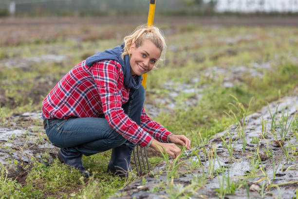 istock woman farmer in small farm 876660480