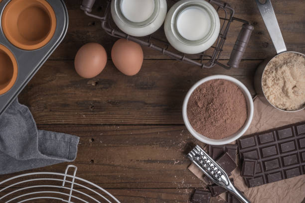 istock Ingredients to cooking muffins in a rustic setting on wooden table with copyspace. 876660702