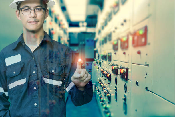 istock Double exposure of  Engineer or Technician man press his finger action in switch gear electrical room of oil and gas platform or plant industrial for monitor process, business and industry concept. 876660938