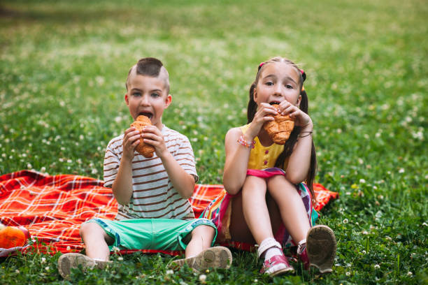 istock Children delicious snack picnic nature concept. 876664050