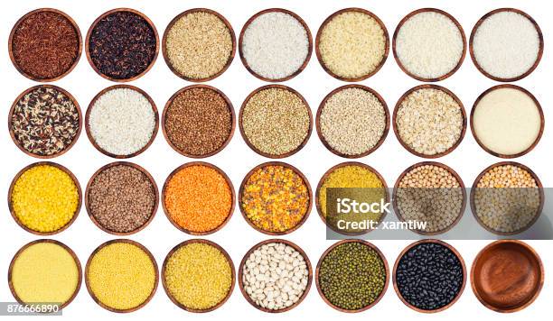 Collection Of Different Groats Isolated On White Background Top View Of Peas Cereals Rice Legumes Beans And Lentils In Wooden Bowls Stock Photo - Download Image Now