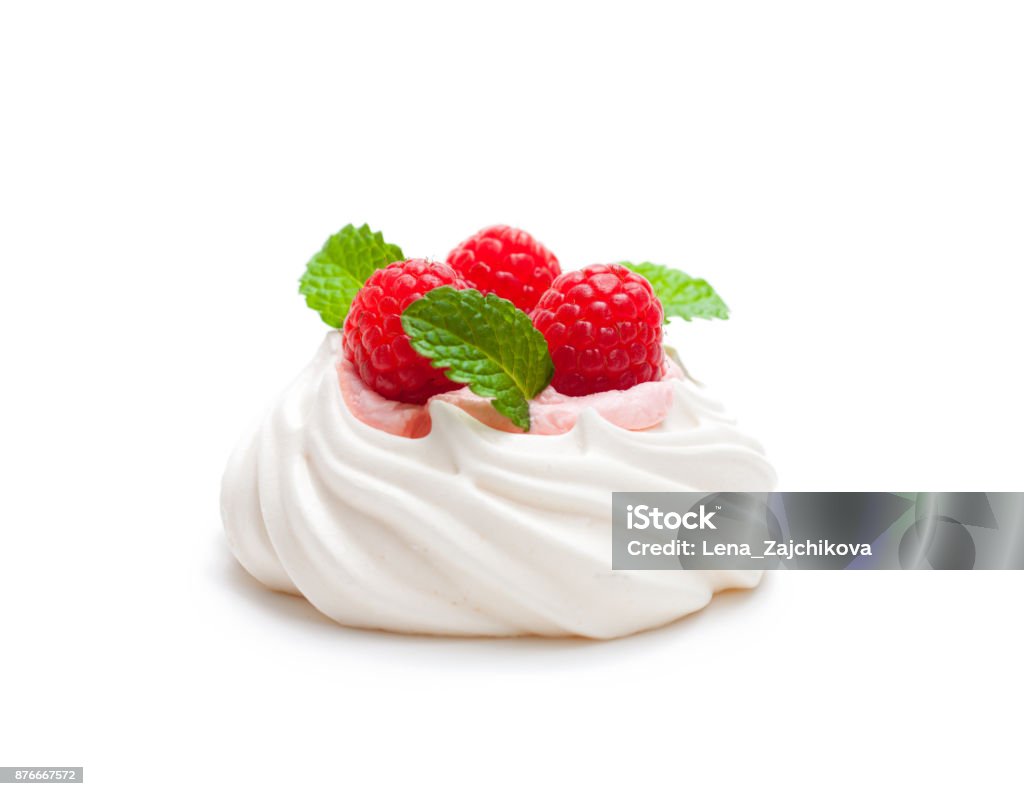 Mini  Pavlova meringue nest with berries and mint on isolated on white Pavlova - Dessert Stock Photo