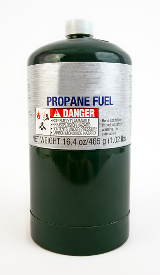 Home and recreational use green quart canister of propane. Vertical.