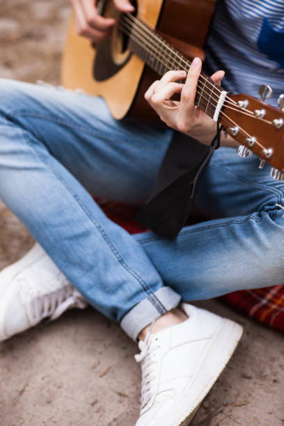 istock Music lifestyle man playing guitar nature concept. 876669738