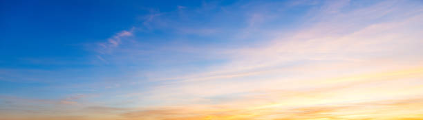 Blue and orange sky at sunset stock photo