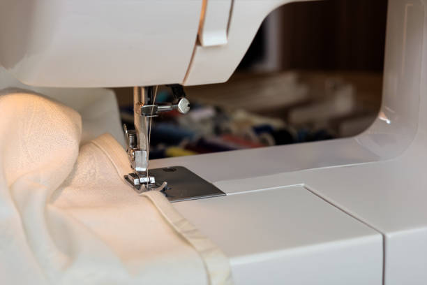 istock The sewing machine's foot with a needle 876674850