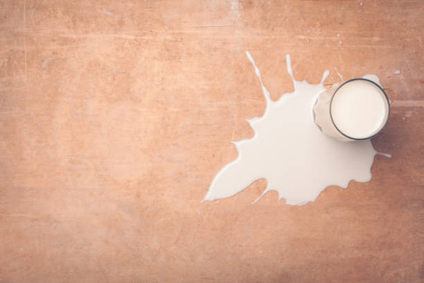 Spilled glass of milk on the floor
