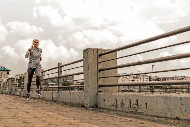 istock Senior Woman Exercising 876679396