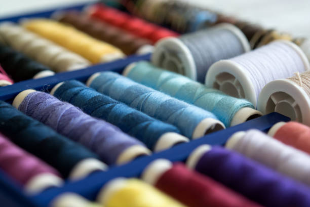 istock A lot of colorful sewing threads in the box 876681950
