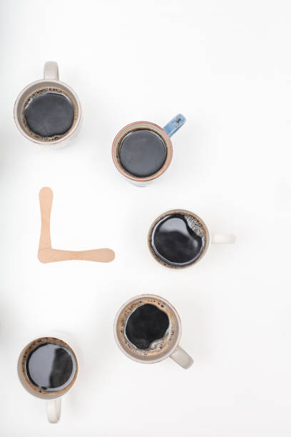 istock Half Clock made of  cups of coffee on white background with copy space 876683122