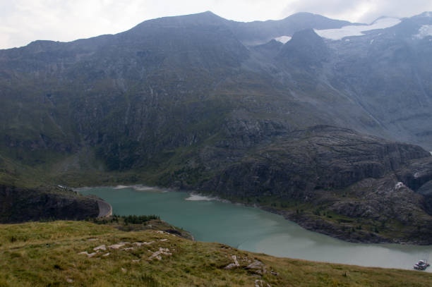 istock Green Alpine lake high in the mountains 876685782