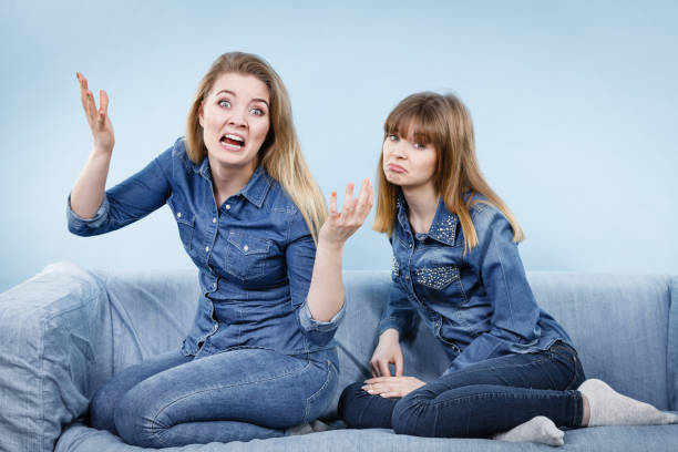 istock Two women friends having weird conversation 876690054