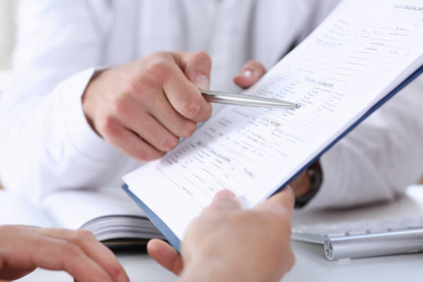 istock Male doctor hand hold silver pen and 876693370