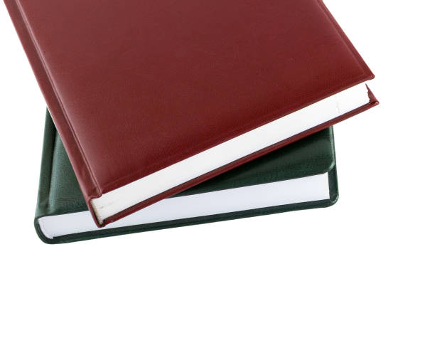 istock Book. Brown and green leather notebook isolated on white background. 876700264