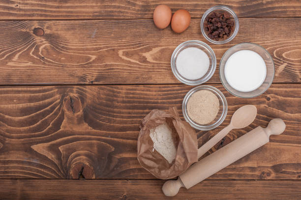 ingredients for biscuits cake on vintage rural wood kitchen table - milk old fashioned retro revival still life imagens e fotografias de stock