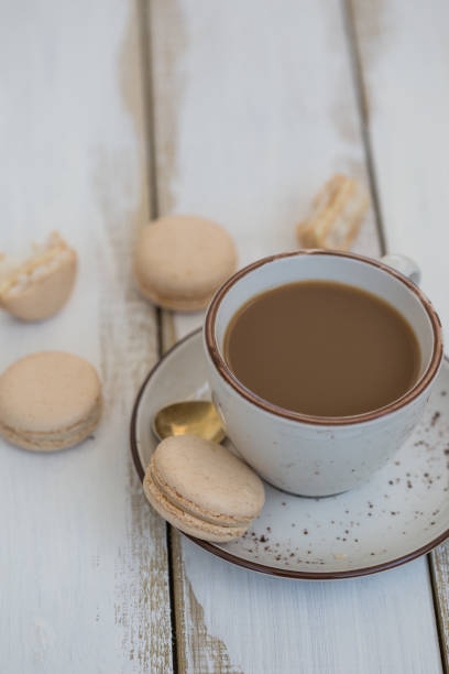 istock a cup of coffee with pink macaroons 876705156