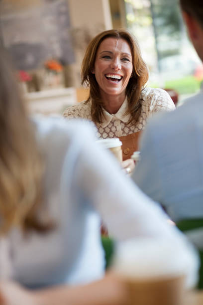 istock Woman smiling in a coffee shop 876705168