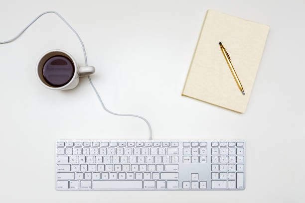 istock White Desk Office Notebook Glasses Keyboard From Above Flat Lay Room for Text Coffee Freelancer Minimalism 876709278