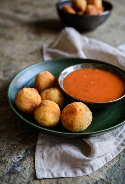 istock Arancini - traditional deep fried rice balls with meat and cheese 876712372