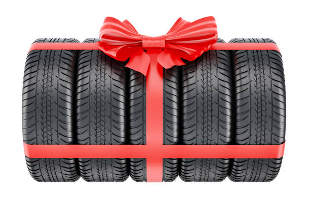 istock Tires wrapped ribbon and bow, gift concept. 3D rendering isolated on white background 876712564