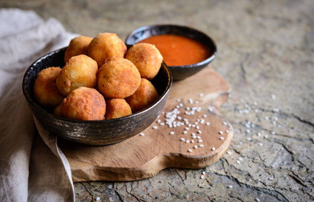 istock Arancini - traditional deep fried rice balls with meat and cheese 876712848